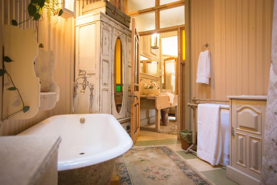 Suite (The Main) | Bathroom | Designer toiletries, hair dryer, bathrobes, slippers