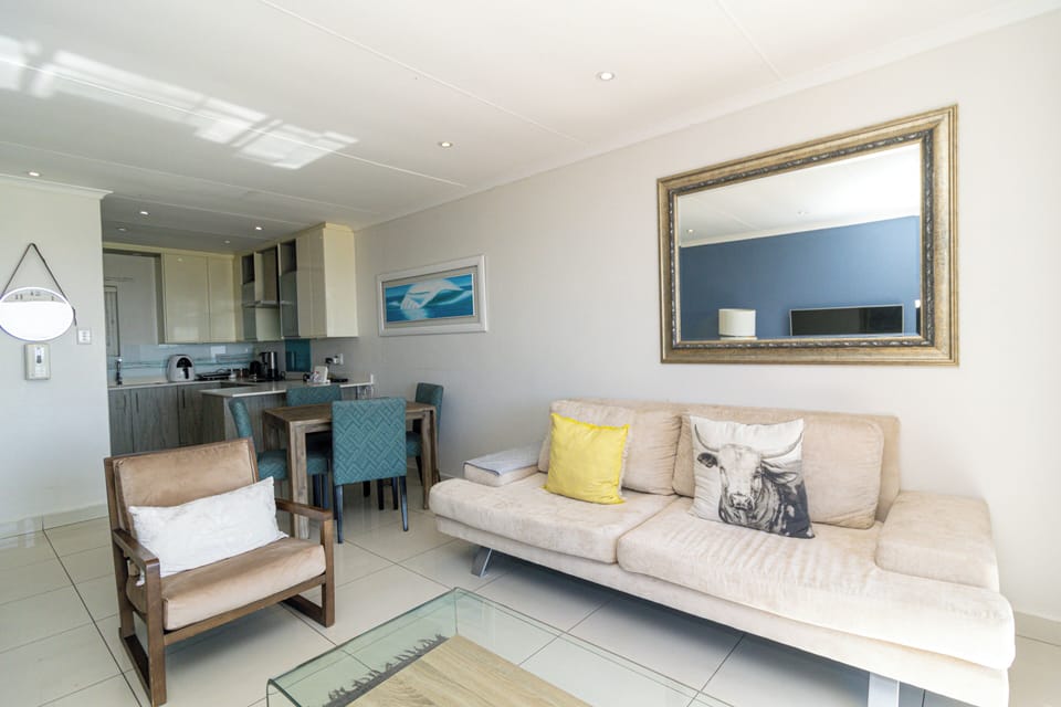 Luxury Apartment, 2 Bedrooms, Ocean View, Beachfront | Living area | Flat-screen TV, DVD player