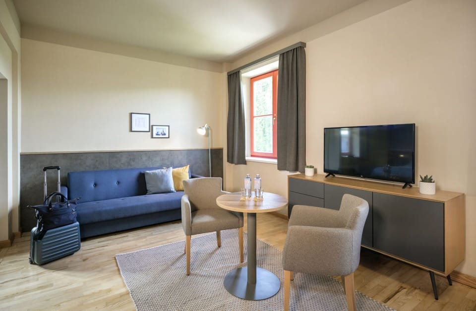 Family Suite | Living area | TV