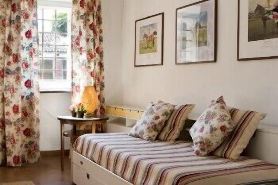 Standard Quadruple Room | Living area | TV