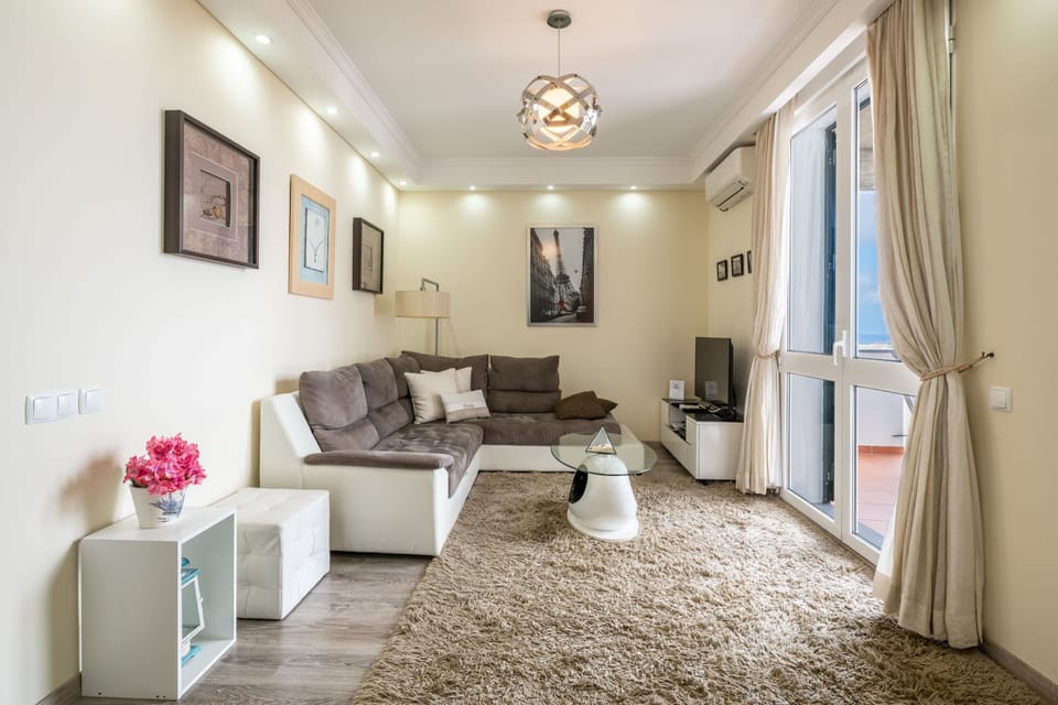 Apartment, 1 Bedroom, Balcony, Sea View | Living area | Flat-screen TV