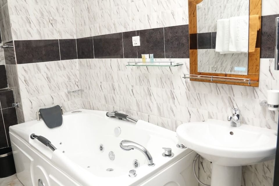 Shower, free toiletries, slippers, towels