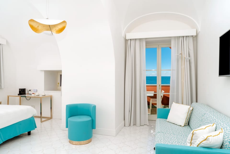 Deluxe Room, Sea View (Superior) | Living area | Flat-screen TV