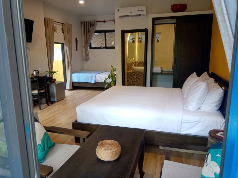 Family Triple Room (The Hidden Garden) | Minibar, in-room safe, individually decorated, individually furnished