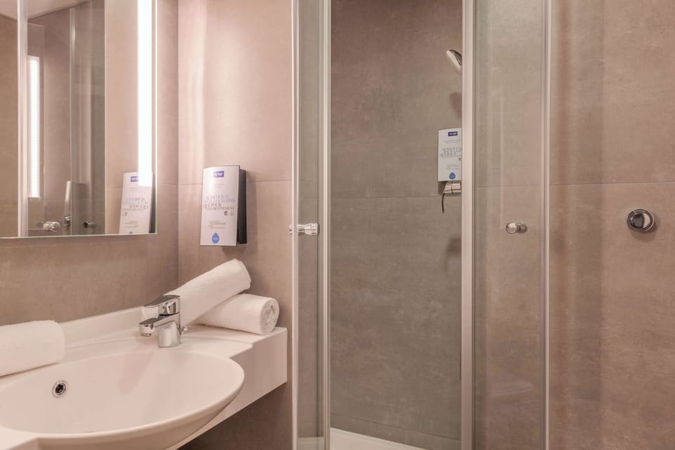Shower, eco-friendly toiletries, hair dryer, towels
