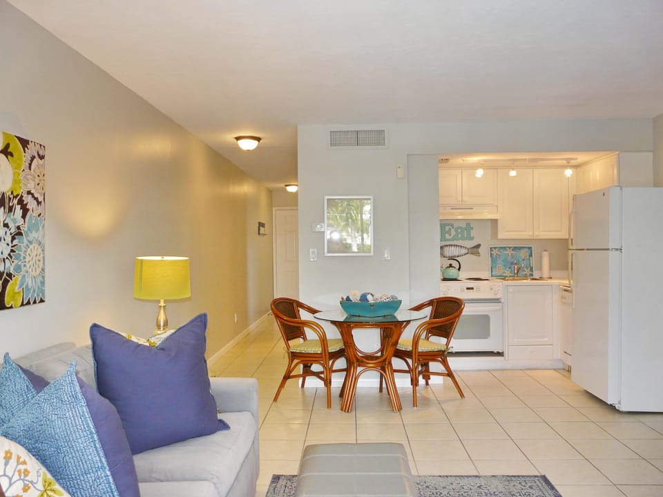 Condo, 1 King Bed with Sofa bed (Idyllic inland condo with pool and be) | Living room | Flat-screen TV