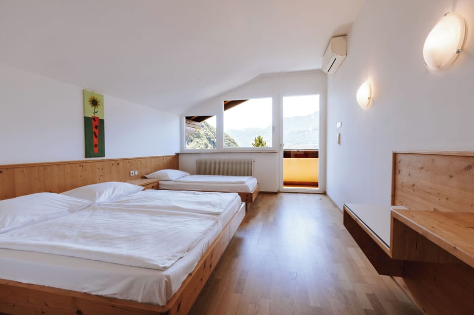 Family Triple Room, Balcony, Pool View | Hypo-allergenic bedding available, in-room safe, desk, laptop workspace