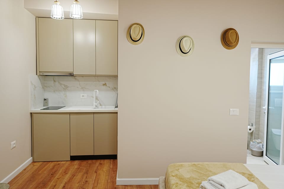 Deluxe Triple Room, Balcony | Private kitchen | Fridge