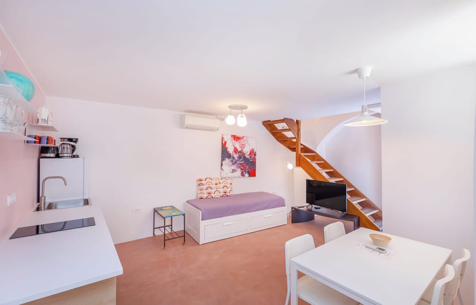 Economy Apartment, 1 Bedroom | Living area | Flat-screen TV