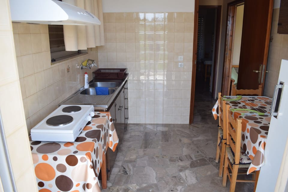 Apartment, 2 Bedrooms | Private kitchenette | Full-size fridge, stovetop, coffee/tea maker, electric kettle