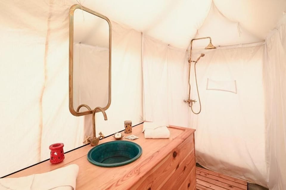 Shower, rainfall showerhead, towels, soap