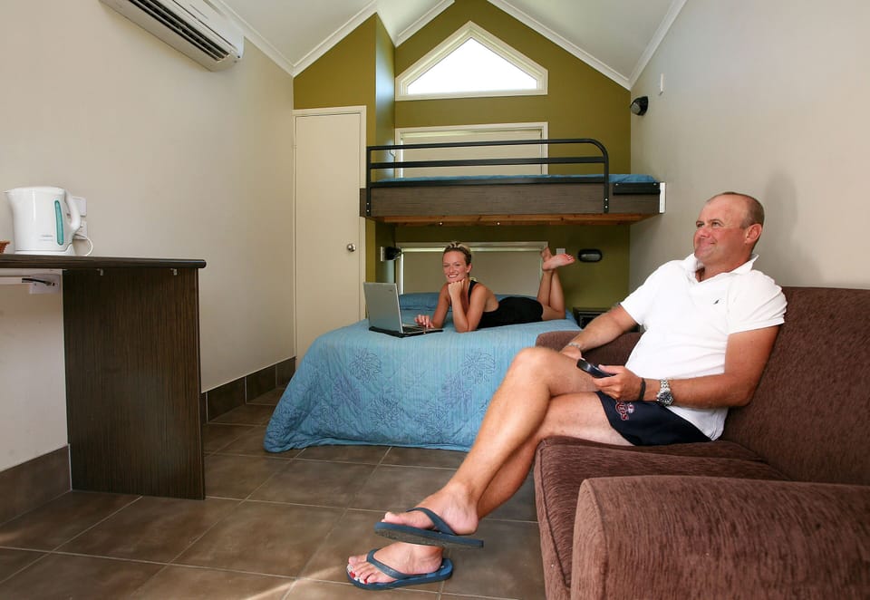 Lodging no ensuite | Living area | 26-inch flat-screen TV with satellite channels, TV