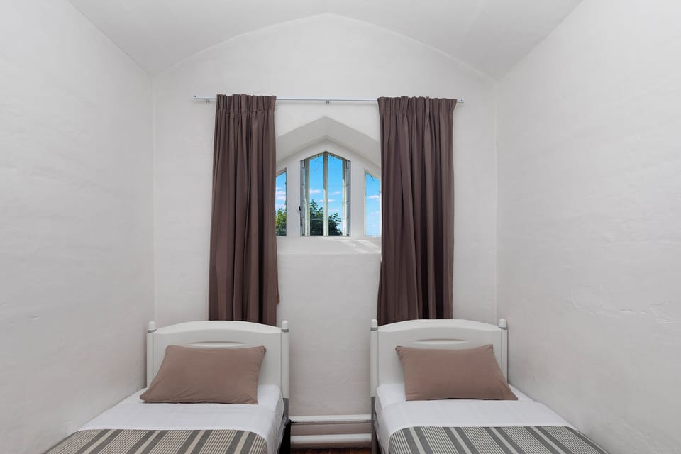 Economy Twin Room, Shared Bathroom | Blackout drapes, WiFi (free), bed sheets