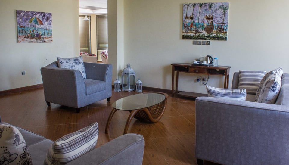 Exclusive Penthouse | Living area | 40-inch LED TV with cable channels, TV, DVD player
