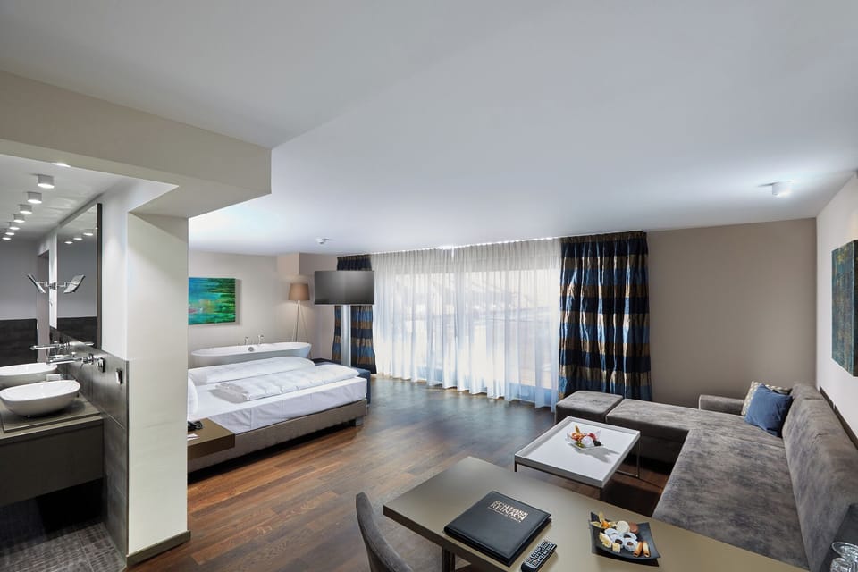 Superior Suite, Multiple Beds, Balcony | Free minibar, in-room safe, desk, laptop workspace