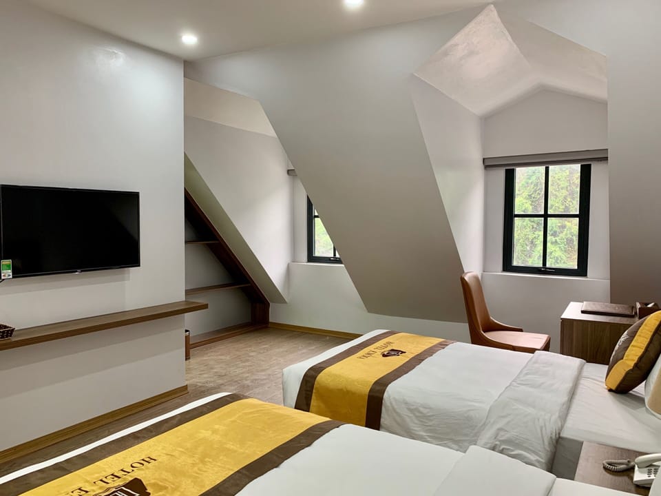 Superior Triple Room | Minibar, in-room safe, desk, iron/ironing board