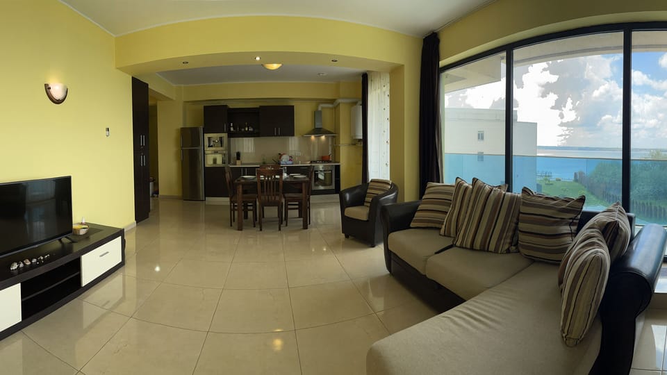 Premium Apartment | Living area | 81-inch LCD TV with digital channels, TV