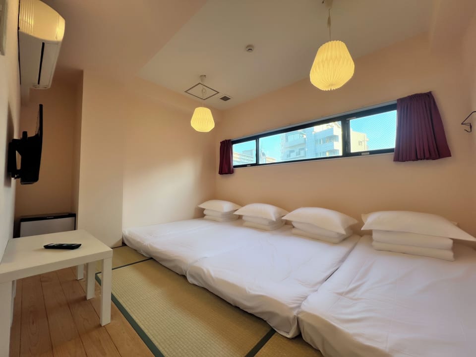 Economy Quadruple Room, Non Smoking, Shared Bathroom | Free WiFi, bed sheets