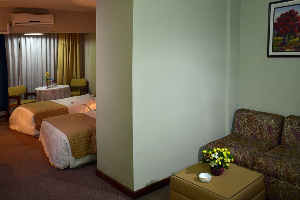 Family Room | Down comforters, minibar, in-room safe, desk