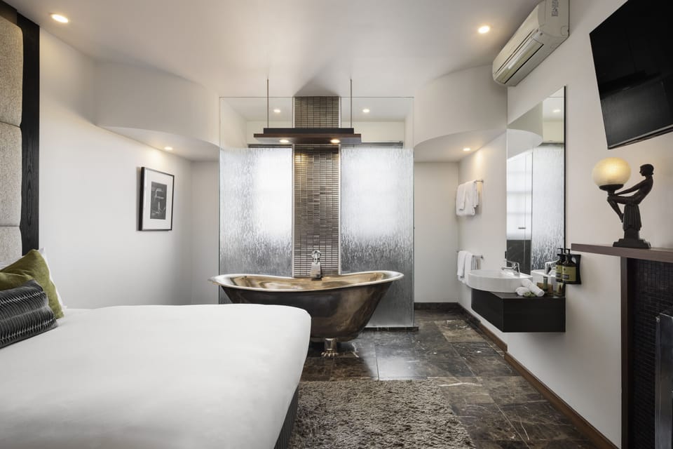 Bathroom | Shower, designer toiletries, hair dryer, bathrobes
