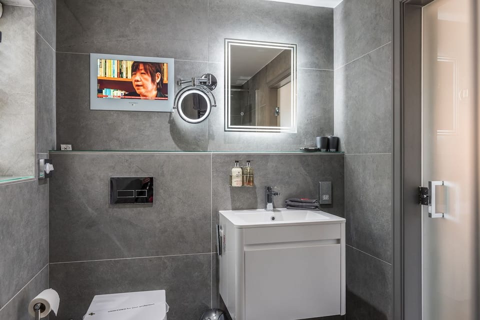 Shower, designer toiletries, hair dryer, heated floors