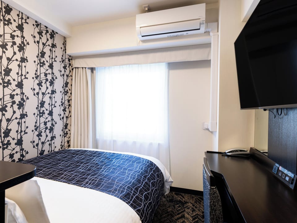 Economy Double Room, Non Smoking | Down comforters, in-room safe, desk, blackout drapes
