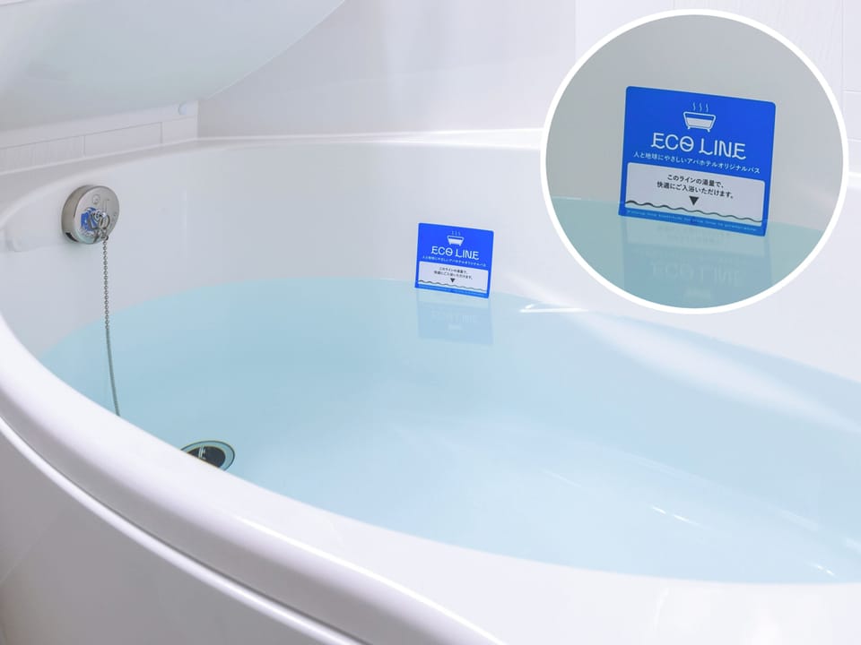 Combined shower/tub, free toiletries, hair dryer, slippers