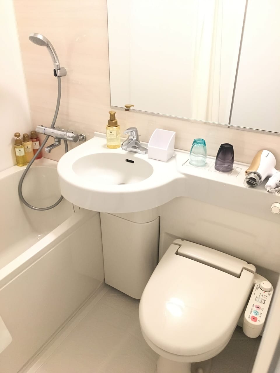 Combined shower/tub, free toiletries, hair dryer, slippers