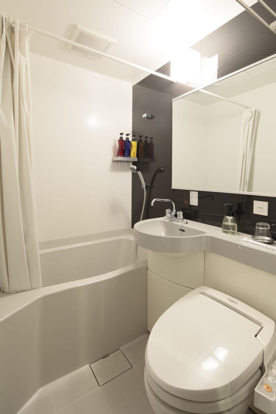 Combined shower/tub, free toiletries, hair dryer, slippers