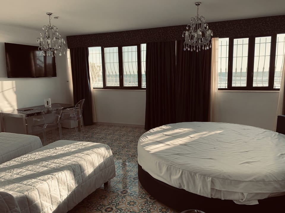 Quadruple Room | Minibar, in-room safe, desk, cribs/infant beds