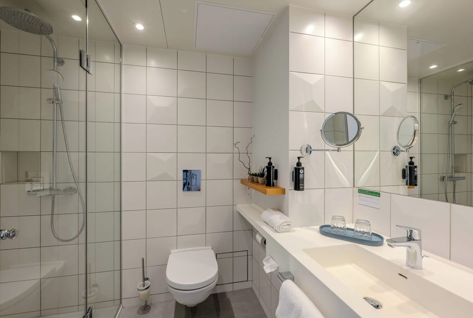 Shower, eco-friendly toiletries, hair dryer, towels