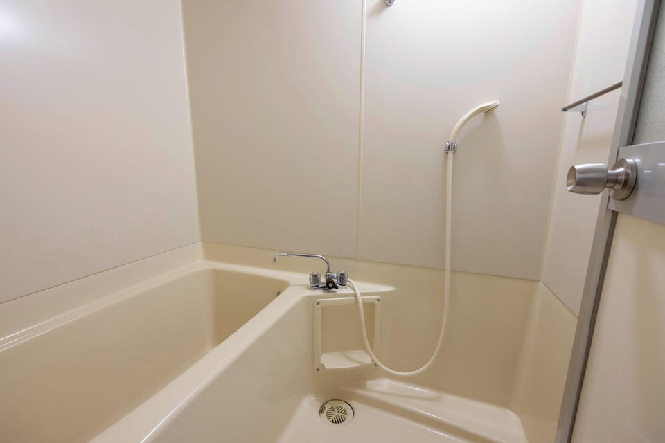 Shower, free toiletries, hair dryer, slippers