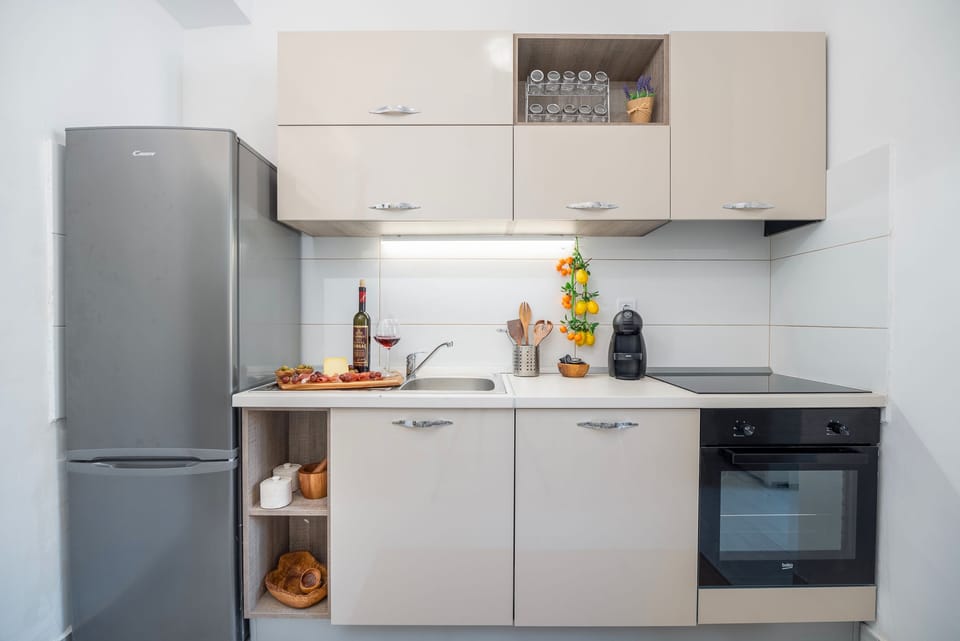 Classic Apartment, Balcony | Private kitchen | Full-size fridge, microwave, oven, stovetop