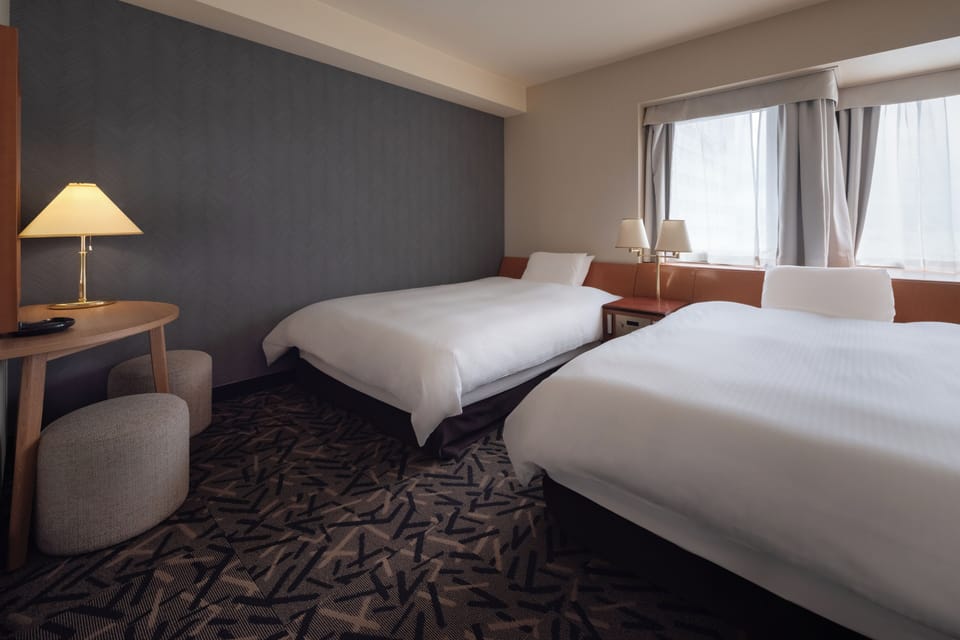 Down comforters, desk, blackout drapes, WiFi (free)