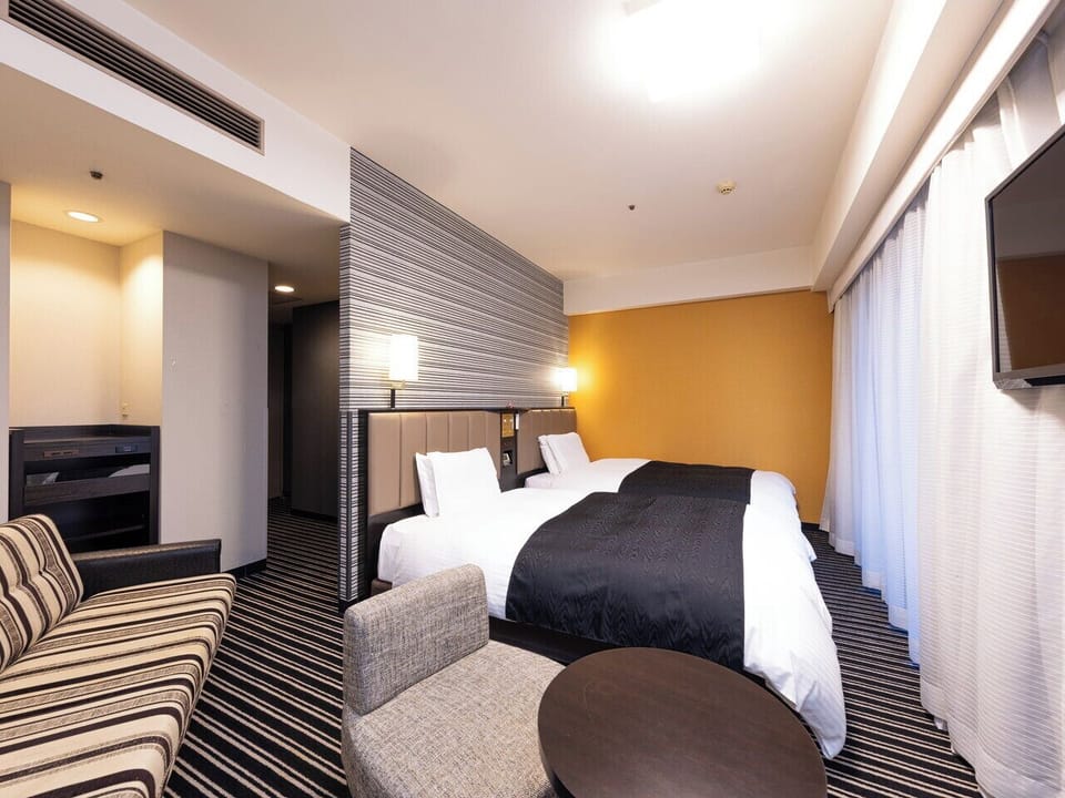 Down comforters, desk, blackout drapes, soundproofing
