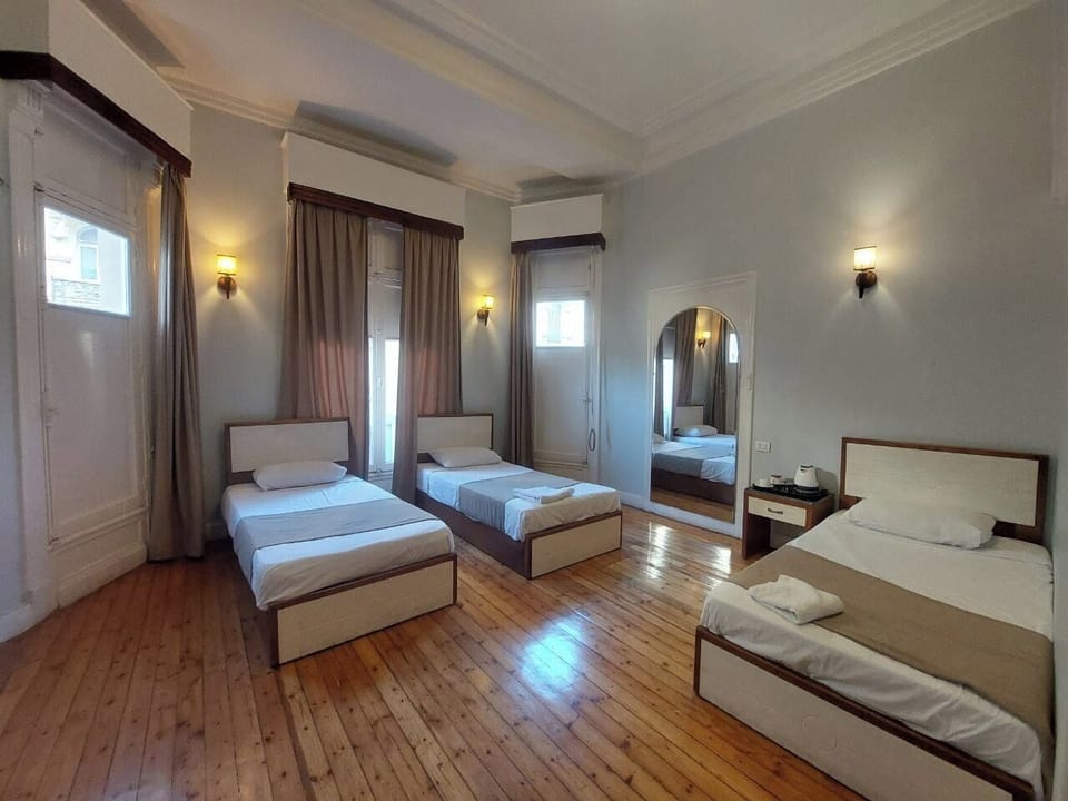 Classic Quadruple Room | In-room safe, individually decorated, desk, laptop workspace
