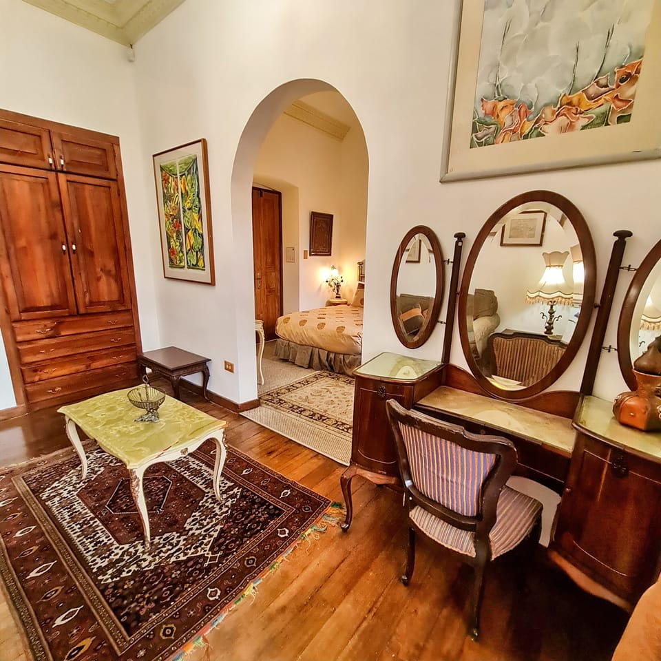 Deluxe Quadruple Room, Multiple Beds, City View | Living area