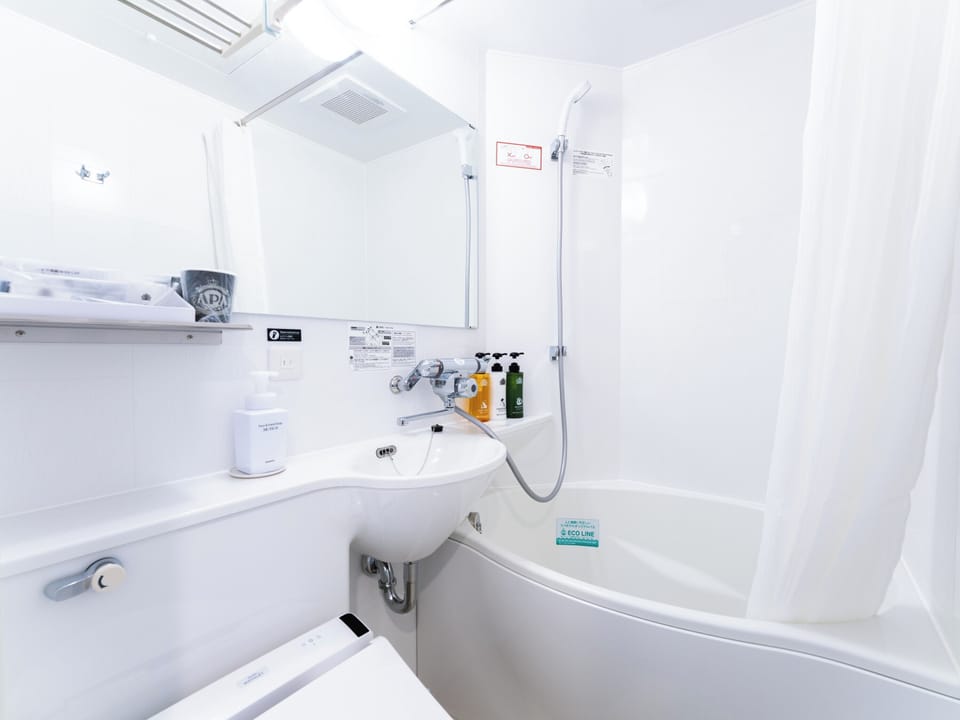 Combined shower/tub, free toiletries, hair dryer, slippers
