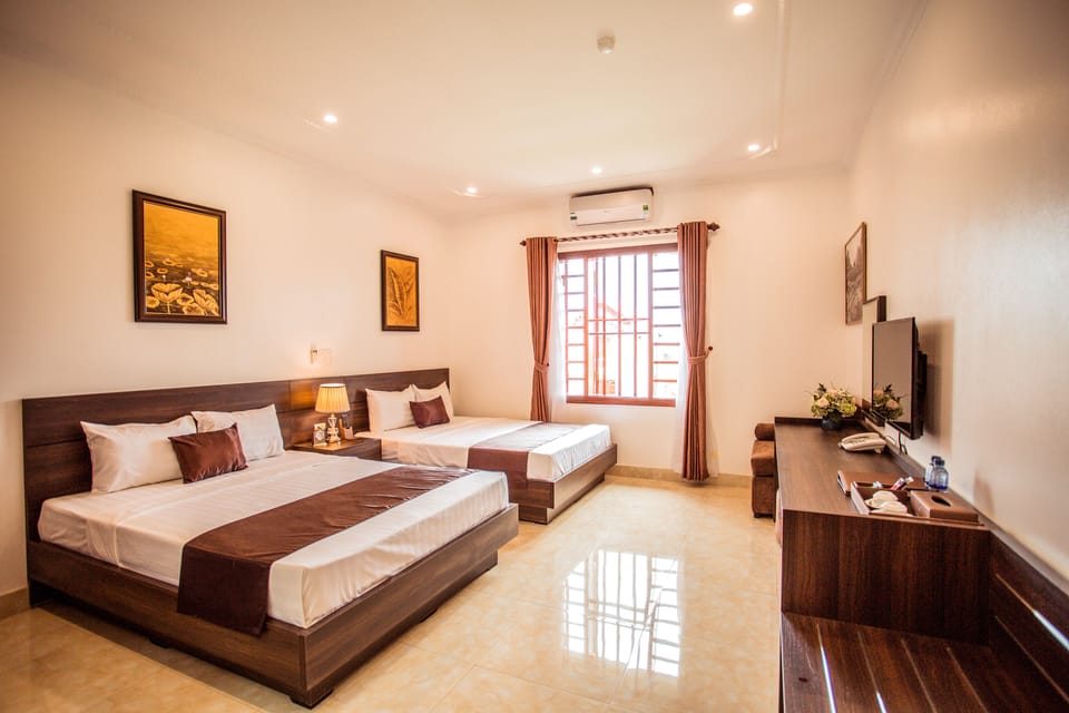Deluxe Twin Room, City View | Minibar, in-room safe, desk, laptop workspace