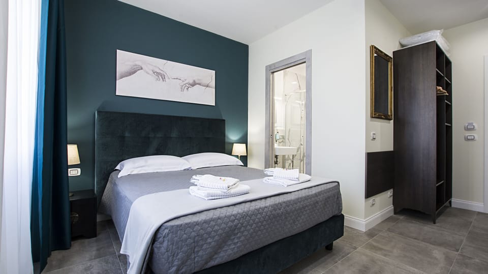 Economy Triple Room | Minibar, in-room safe, desk, laptop workspace