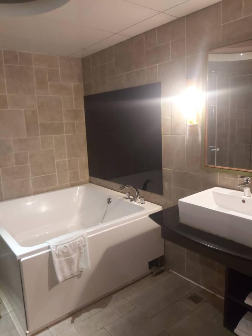 Separate tub and shower, free toiletries, hair dryer, slippers