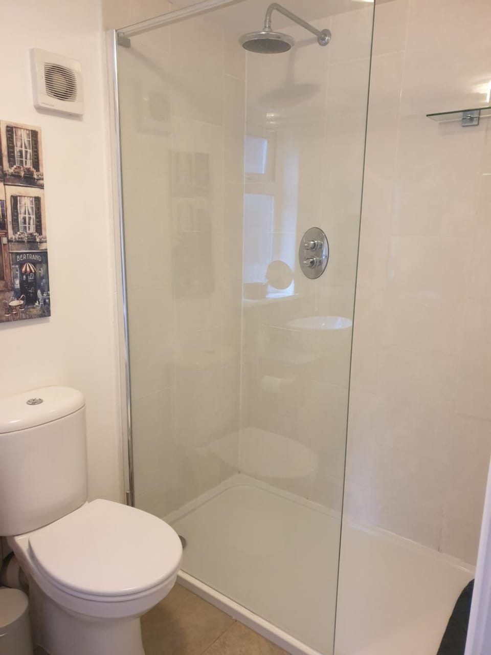 Shower, rainfall showerhead, hair dryer, towels