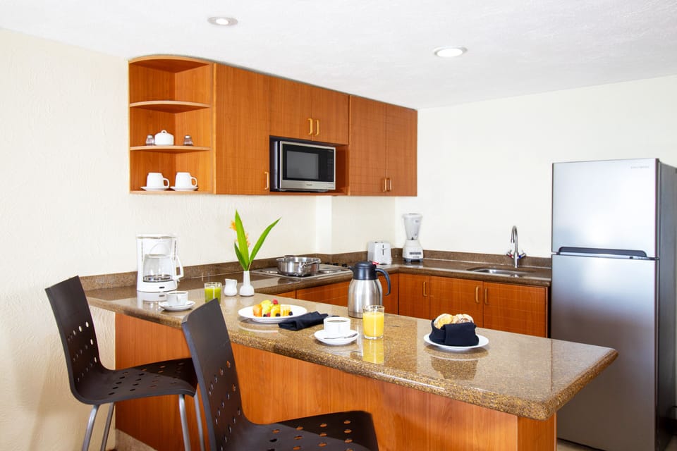 Two Bedroom Family Suite Ocean View | Private kitchen | Coffee/tea maker