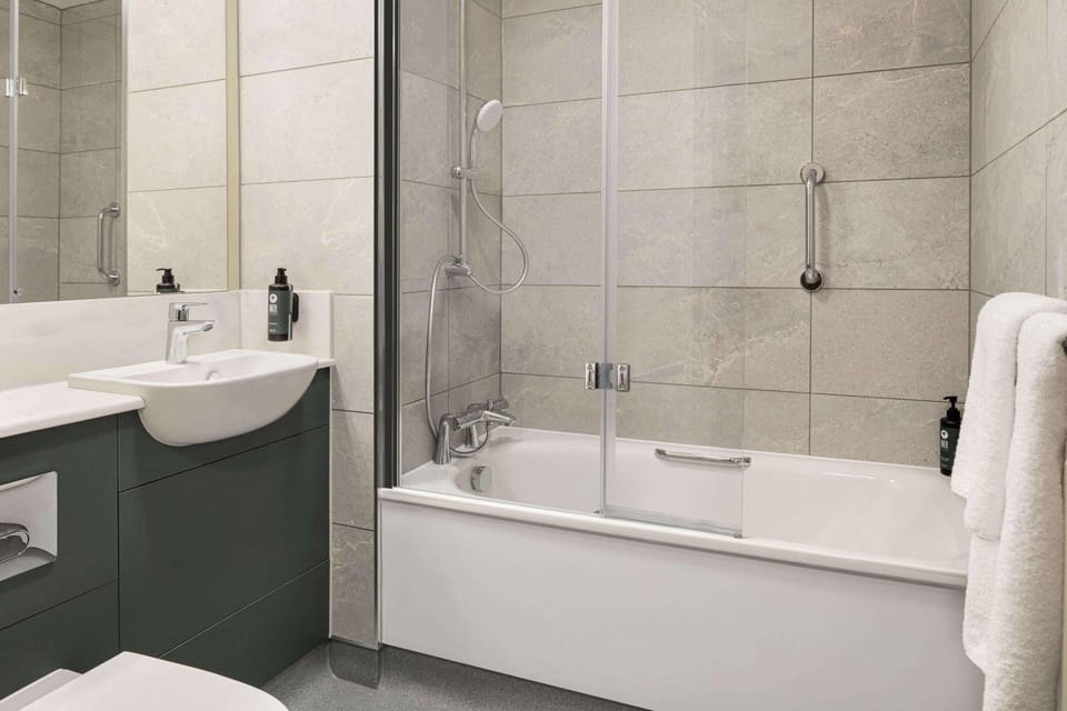 Eco-friendly toiletries, hair dryer, towels, toilet paper