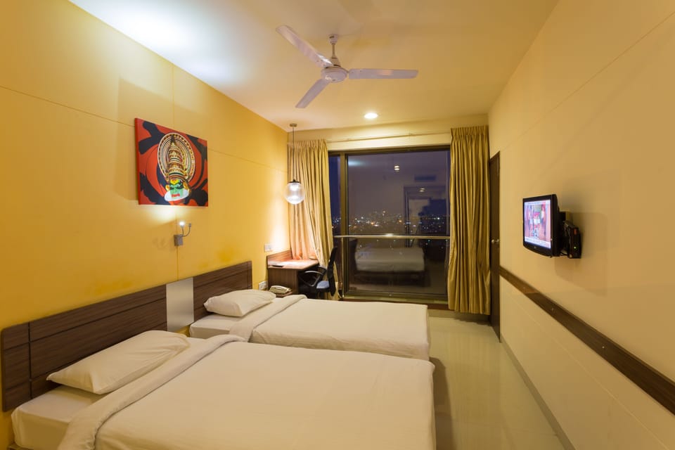 Queen Room | Minibar, in-room safe, desk, iron/ironing board