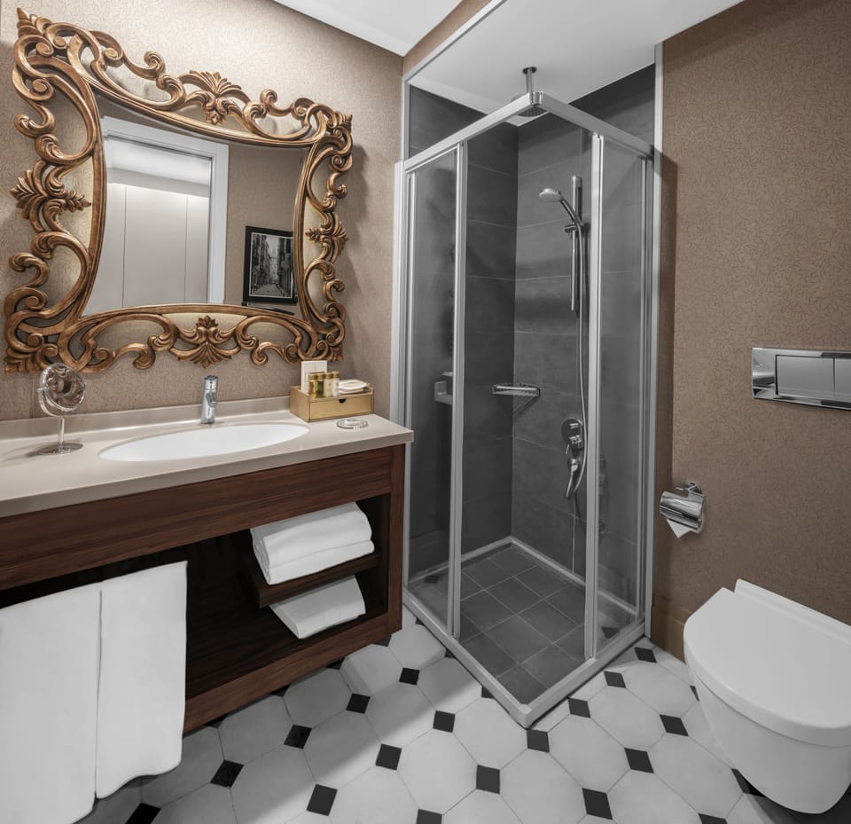 Shower, free toiletries, hair dryer, slippers