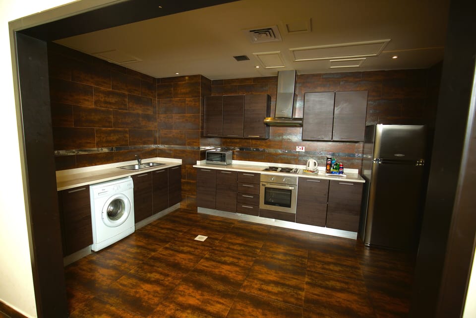 Family Suite, 3 Bedrooms, City View | Private kitchen | Fridge, electric kettle, highchair, paper towels