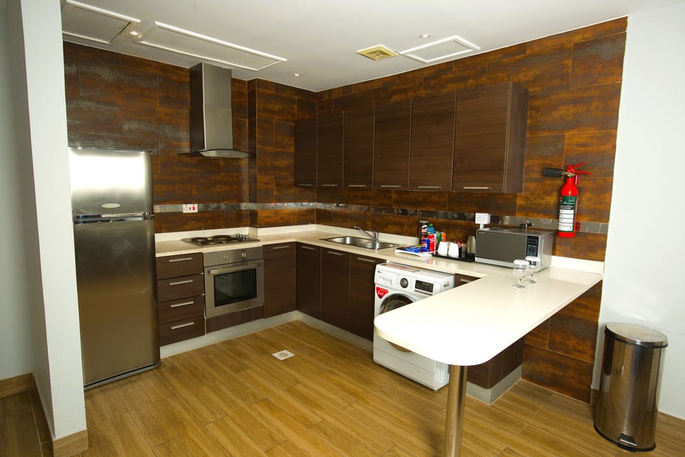 Executive Suite, 1 Bedroom, City View | Private kitchen | Fridge, electric kettle, highchair, paper towels