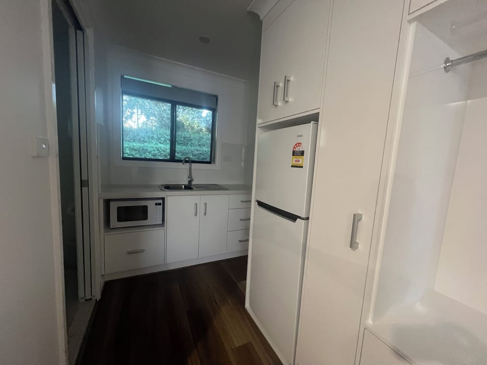 Premium Triple + Kitchenette Pet Friendly | Private kitchenette | Fridge, microwave, toaster