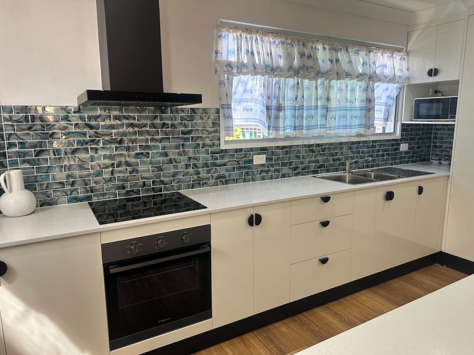 Deluxe Apartment | Private kitchen | Fridge, microwave, coffee/tea maker, electric kettle